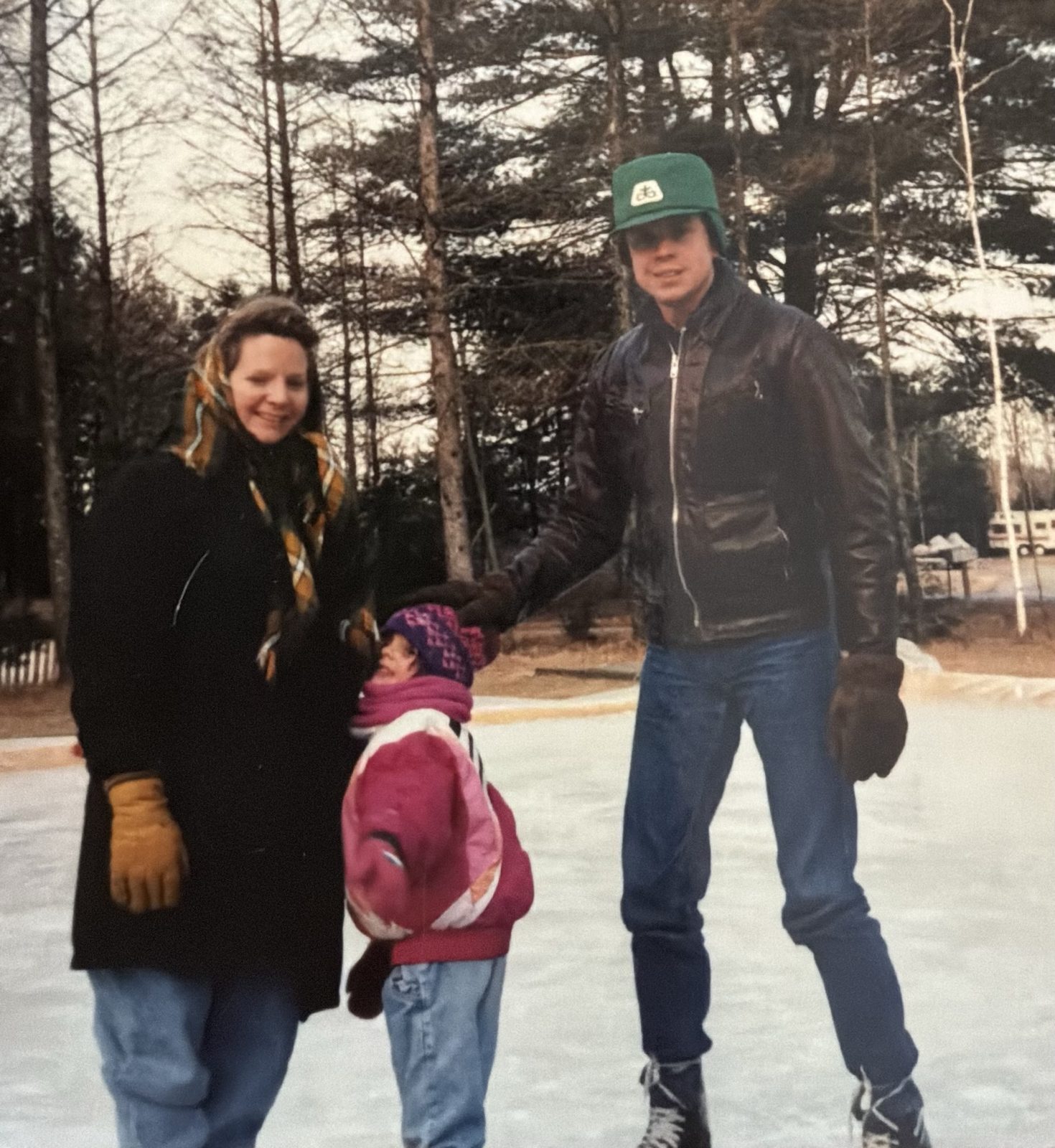 Henry with his wife and young daughter ice skating when he was younger